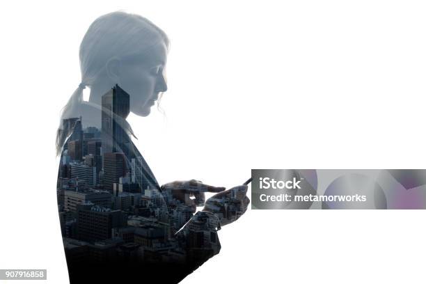 Double Exposure Of Businesswoman And Building Exterior Stock Photo - Download Image Now