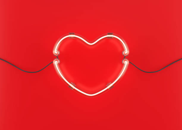 istock Neon heart on red background. 907918118