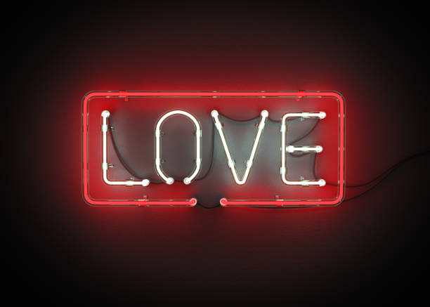 istock Neon sign, The letters LOVE on a black background. 907918194