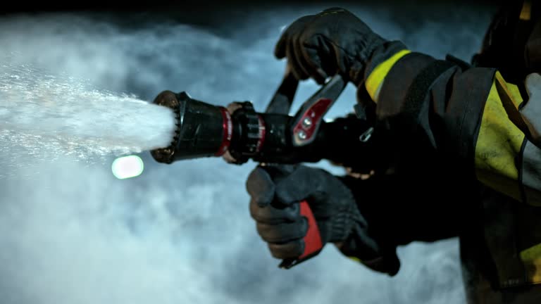 SLO MO LD Firefighter closing the fire hose