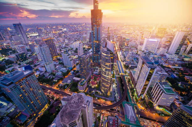 istock Panoramic view Cityscape business district from aerial view high building at dusk (Bangkok, Thailand) 907921404