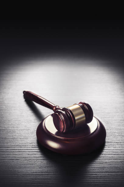 istock judge gavel on a black  wooden background 907928256