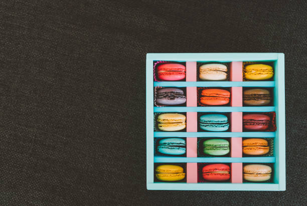 istock Assorted colorful sweet macaroons in box 907930810