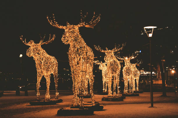 Stockholm, Sweden - December 10, 2017: Floc of Christmas moose made of led light, December 10, 2017, Nybrokajen, Stockholm, Sweden