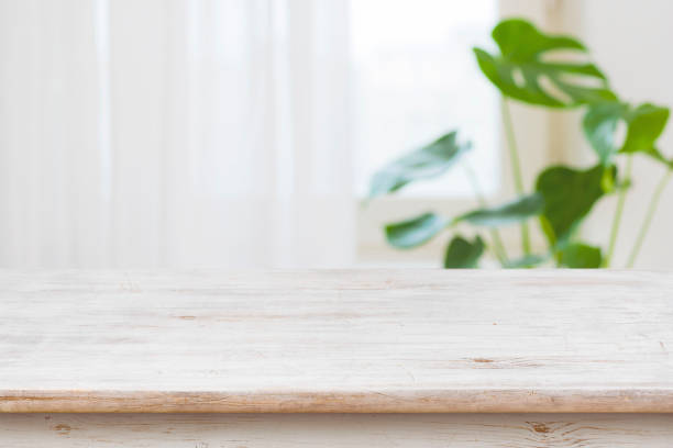 istock Concept of table for product display over defocused window background 907933232