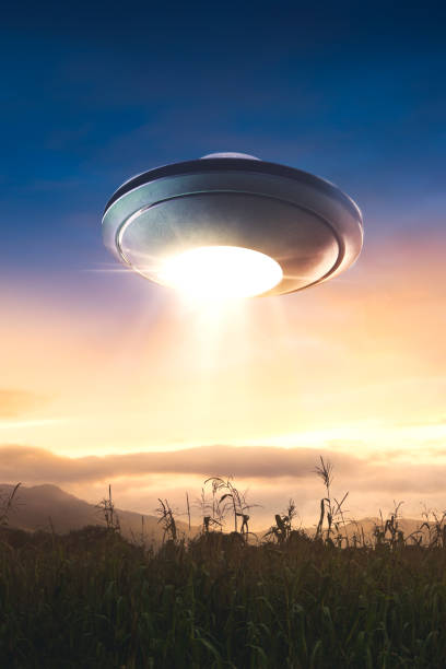 istock UFO with abduction beam flying in the sky 907933234