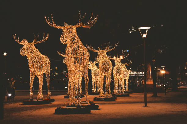 Stockholm, Sweden - December 10, 2017: Floc of Christmas moose made of led light, December 10, 2017, Nybrokajen, Stockholm, Sweden