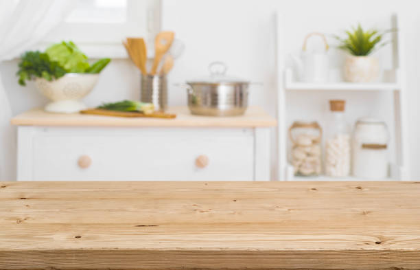 istock Table top with blurred kitchen furniture as background 907933604