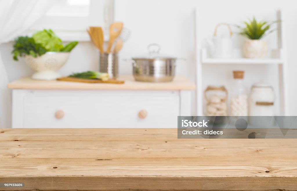 Table top with blurred kitchen furniture as background Kitchen Stock Photo