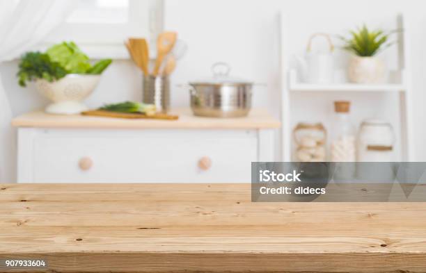 Table Top With Blurred Kitchen Furniture As Background Stock Photo - Download Image Now