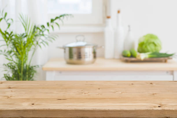 Table top with blurred kitchen interior as background stock photo
