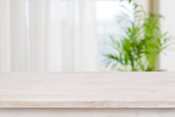 istock Table mockup for display of product over blurred window background 907933720