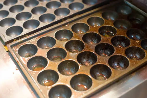 Photo of Takoyaki pan standby for cooking.