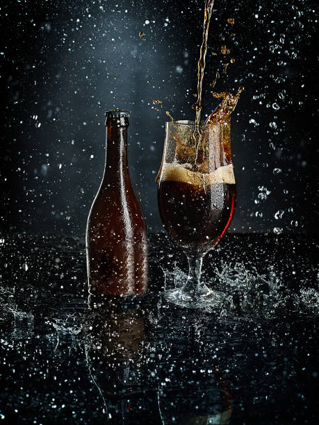 istock Beer in glass on a black background 907934112
