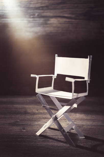istock paper director chair on a blueish grey background 907935264