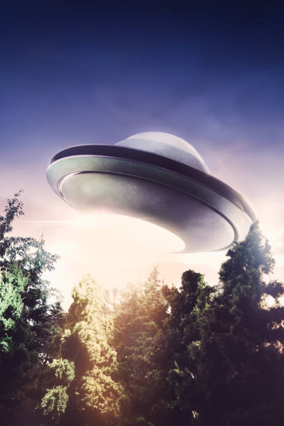 istock UFO with abduction beam flying in the sky 907936100