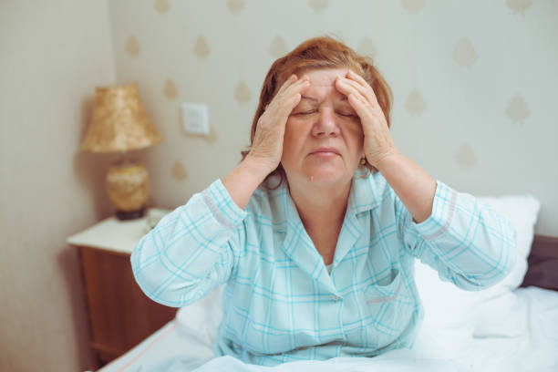 istock Worried old woman has headache at home. 907936718