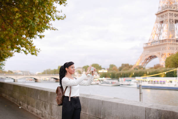 istock Blogger traveling, pretty lady shooting video using smartphone 907936866