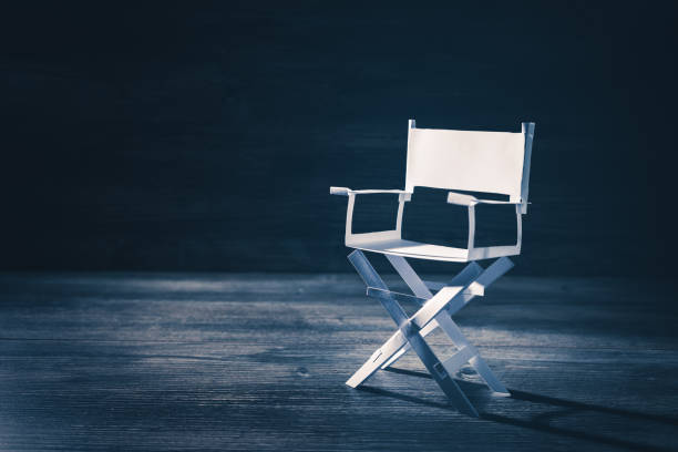 istock paper director chair on a blueish grey background 907937364