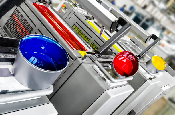 Printing solutions: offset printer 4 colors print units with color pots stock photo