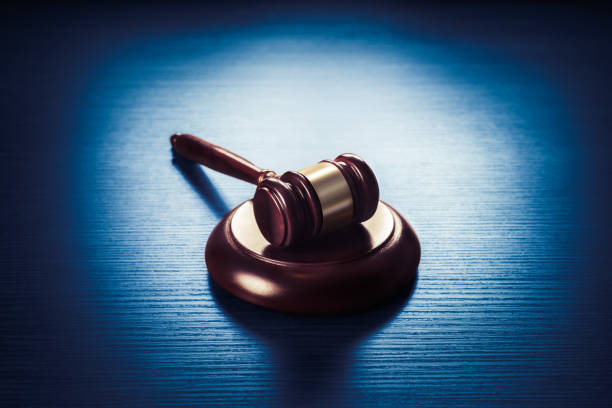 istock judge gavel on a blue wooden background 907939088