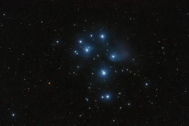 The Pleiades - the best known open cluster in the sky. They owe their popularity mainly to the fact that they can be admired even with the unaided eye. This cluster is located in the constellation of the bull and is about 444 light years away from us. This young cluster - about 100 million years old - is surrounded by a blue nebula.