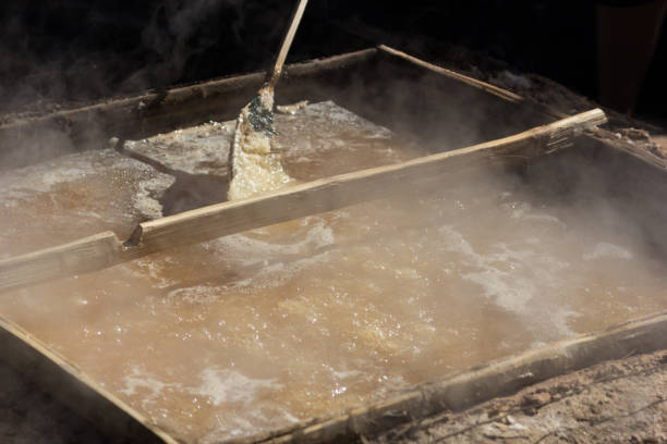 istock Salt production by boiling in the countryside. 907939374
