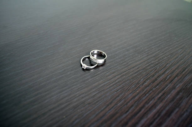 istock two wedding rings in white gold with diamonds 907939714