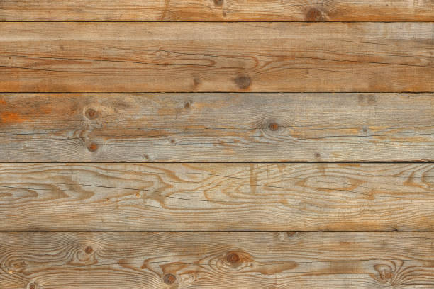 istock Old yellow pine natural barn wall wood background 907940636