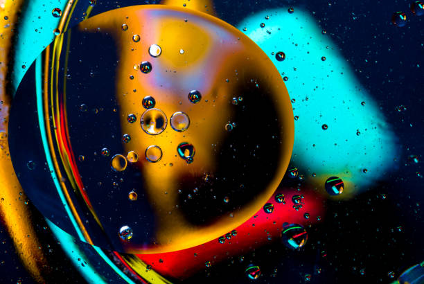 istock Abstract art background blue green red black color drops bubbles. 907940898