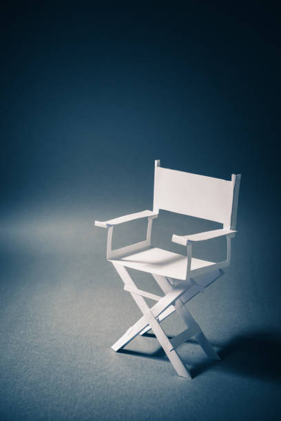istock paper director chair on a blueish grey background 907941698