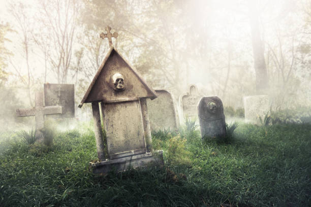 istock gravestone with fog and dramatic lighting 907942626