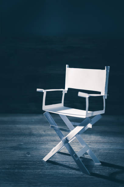 istock paper director chair on a blueish grey background 907943410