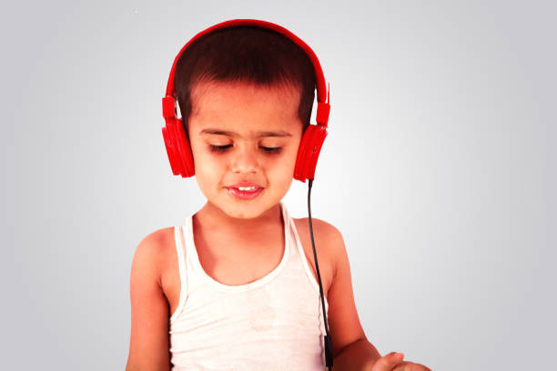 istock Little boy listening songs 907945866