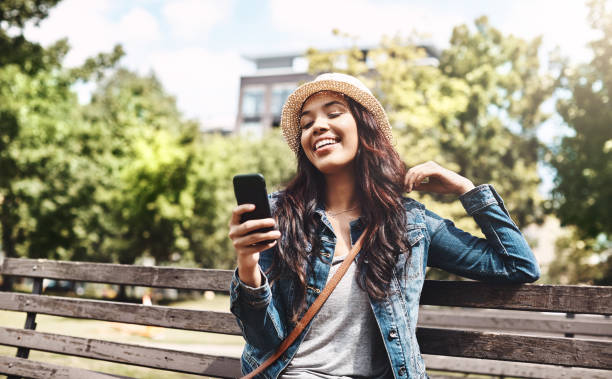 istock In the park with her social media 907946220