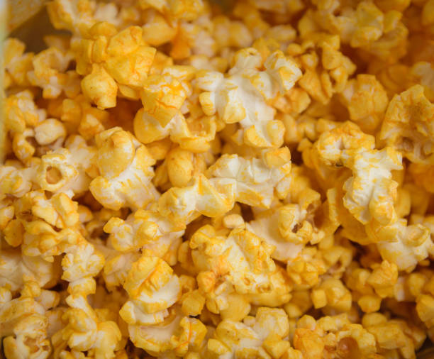 istock Salted popcorn grains with cheese. 907948960