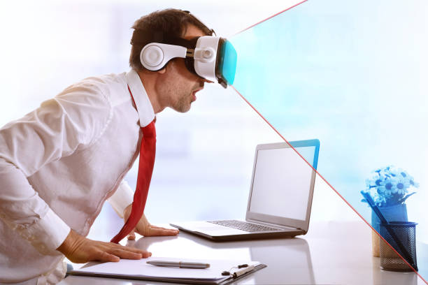 istock Surprised businessman using virtual reality glasses with blue vision representation 907949048