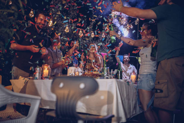 istock Happy people celebrating 907950418
