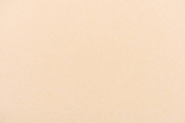 istock texture of beige color paper as background 907951646