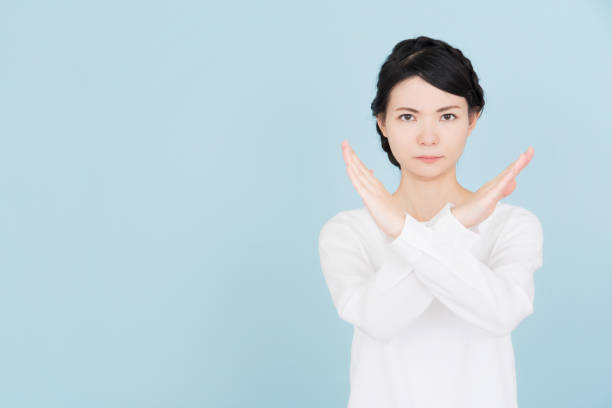 istock Young woman making a stop sign 907952350