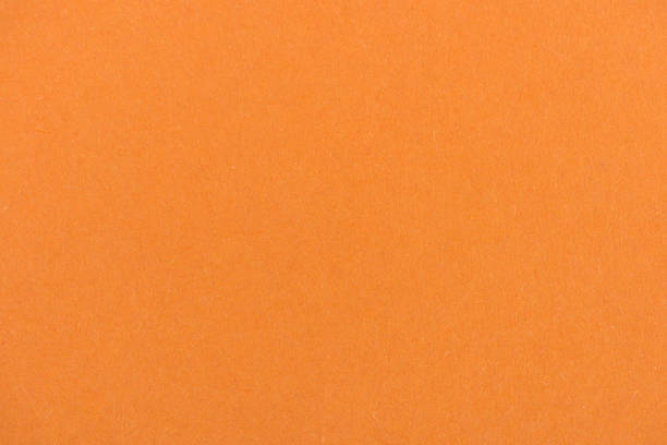 istock texture of orange color paper as background 907952918