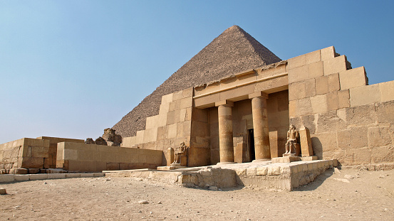 GIZA CAIRO EGYPT - OCTOBER 2009:  Giza Necropolis. Mastaba of Seshemnefer and Pyramid of Cheops.