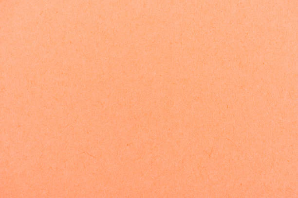 istock texture of peach-orange color paper as background 907954236