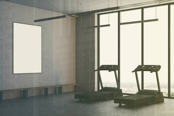 istock Two treadmills in a white room, side view toned 907954610