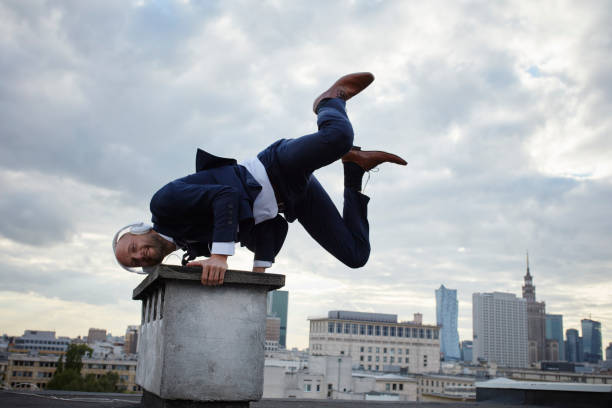 istock Young businessman's rooftop training. Vitality and fun 907955884