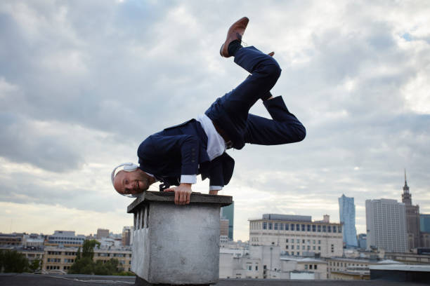 istock Young businessman's rooftop training. Vitality and fun 907955898