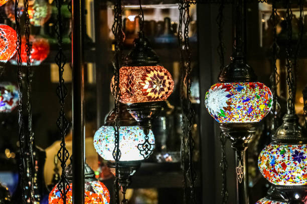 istock Traditional bright decorative hanging Turkish lamps and colourful lights with vivid colours  in the Istanbul Bazaar, Turkey 907956708