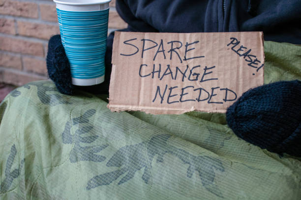 istock Homeless Person Begging for Spare Change 907957454