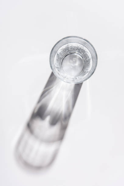 istock top view of glass with water on white table 907957902