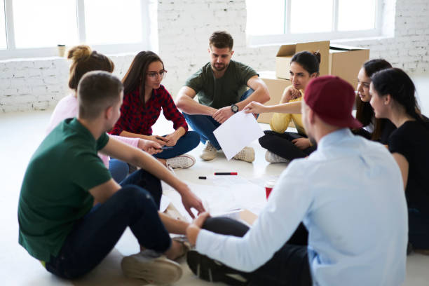 istock Group of coworkers in circle 907960684